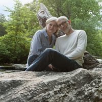 Couple enjoying a serene moment in the woods